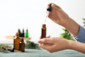 Woman dropping essential oil