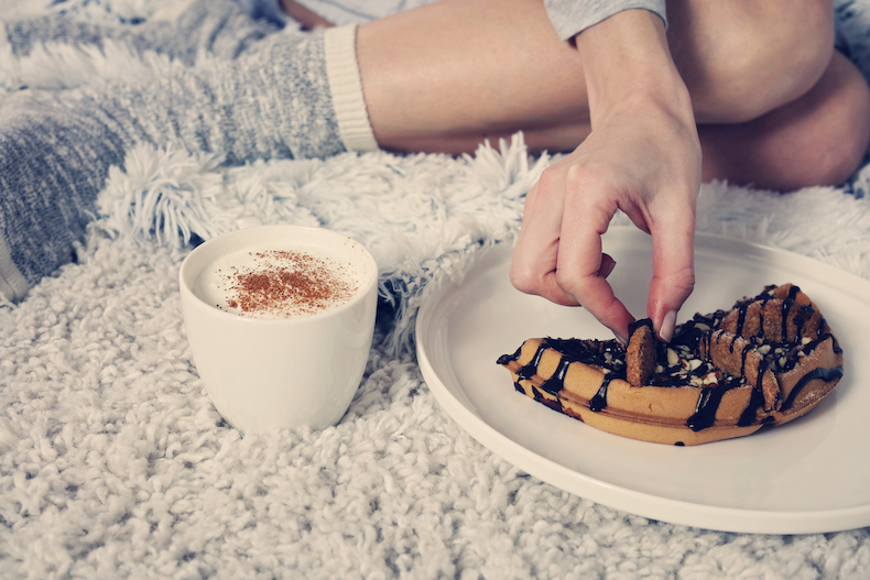 A woman enjoying coffee and cake