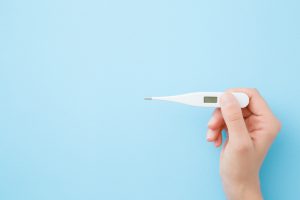 Thermometer and blue background