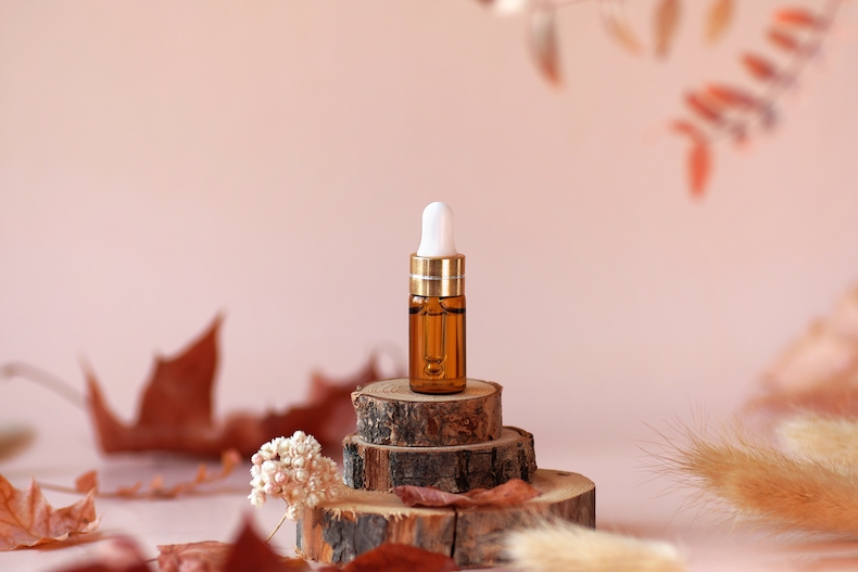 Glass cosmetic on the wooden desk